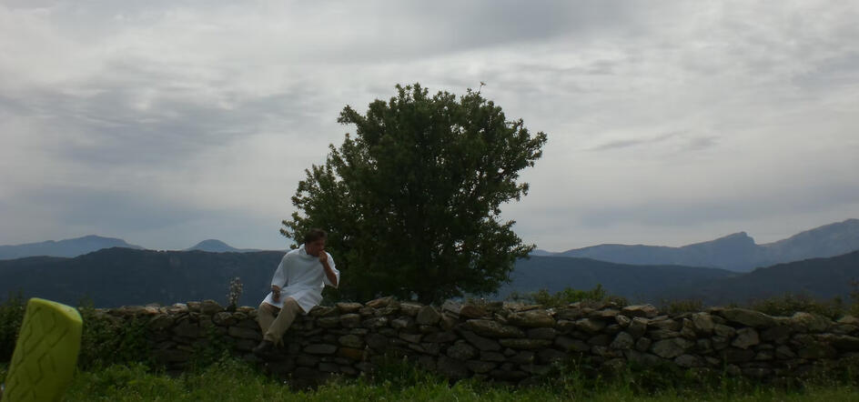 eating an orange dressed as a priest in sardinia wtf